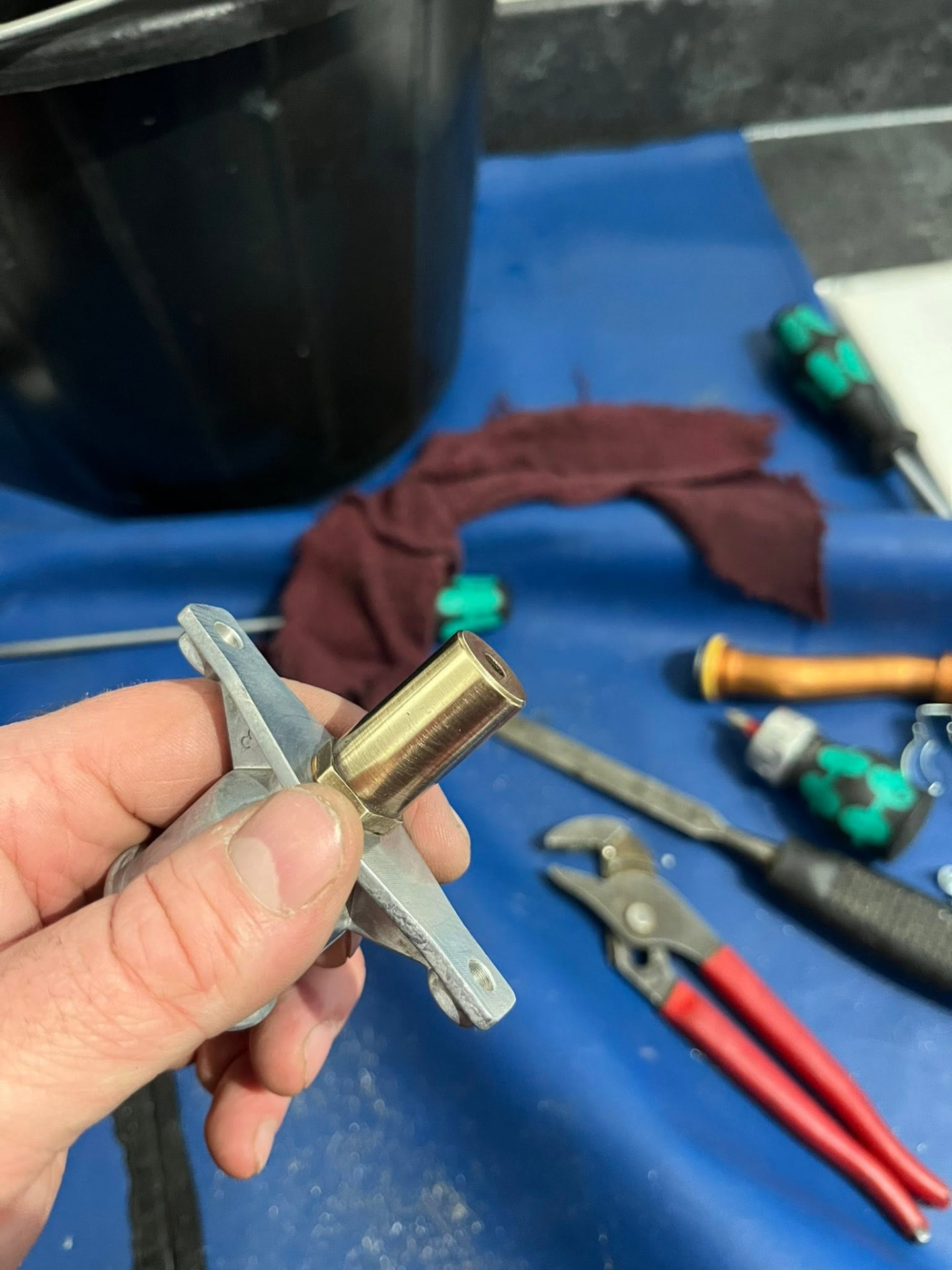 Gas Safe engineer inspecting a boiler injector during a service